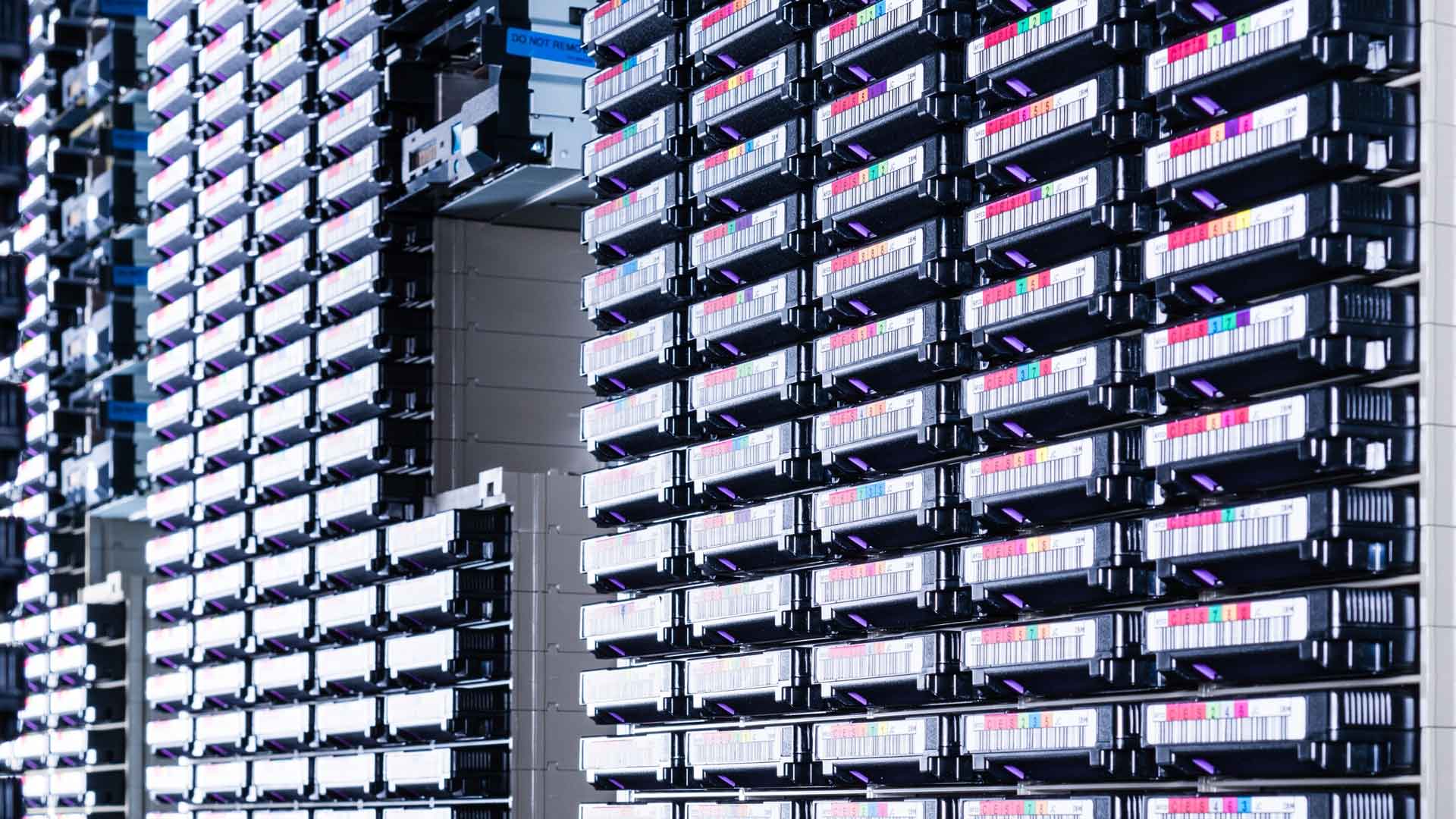 Rows of secure offsite data backup tapes in storage